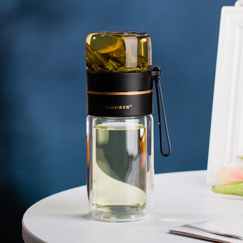 Teflaska i dubbelväggigt glas med tesil i rostfritt stål